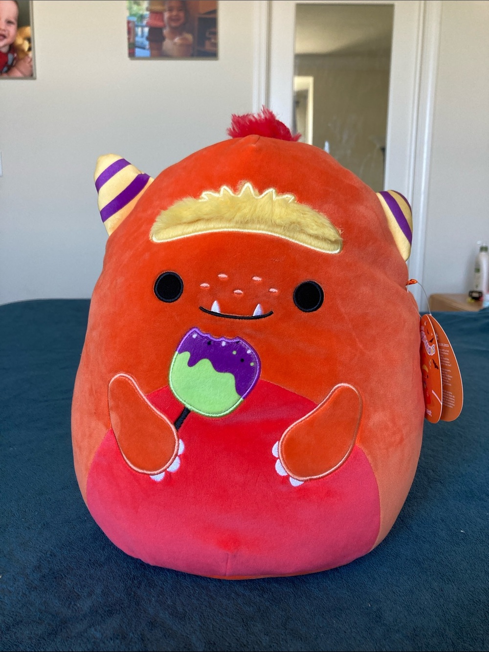 Squishmallows Halloween Ernest Orange Monster Plush with Yellow Hair and Purple-